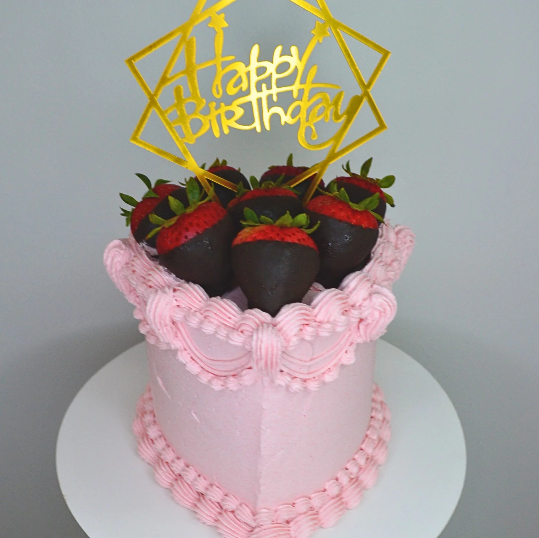 #128. This is a 4" heart-shaped, 3-layer pink strawberry cake with fresh organic chocolate-dipped strawberries.