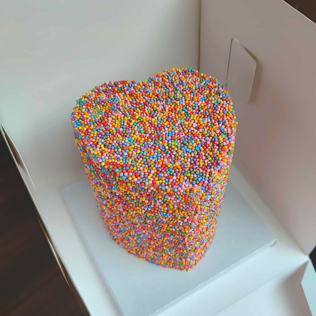 #5. This is a 4" heart-shaped, 3-layer sprinkle cake.