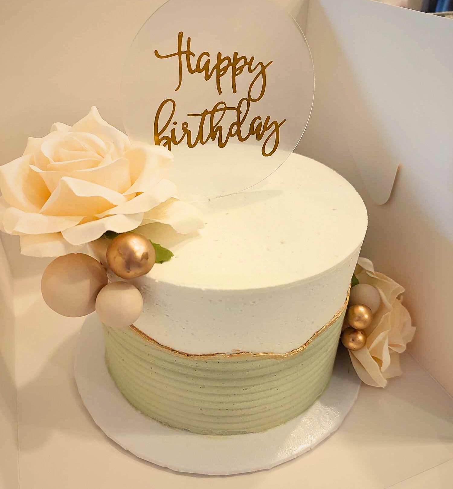 #17. Cake with a ridged overlay on bottom half and edible gold painted around the top edge of the overlay.