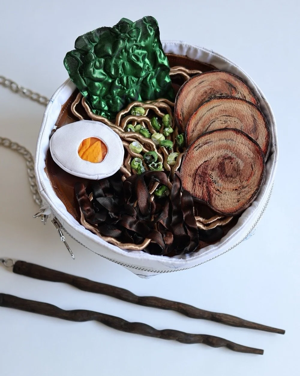RAMEN PURSE 🍜 So excited to show you this piece (available Thursday 14th May, 5:00pm BST) I&rsquo;ve been wanting to make for over a year! 

Each ingredient was lovingly handcrafted (my favorite is the leather pork slices). The bowl is hand painted 