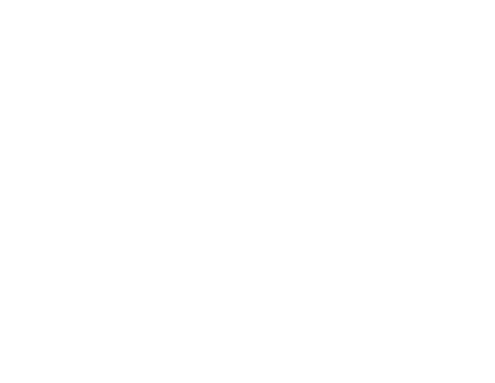 A black and white logo featuring a stylized tree with visible roots inside a circle. The circle is encircled by a triangle with an uppercase letter A at the top. Below the logo, the text reads 'THE SHINY VINE.'