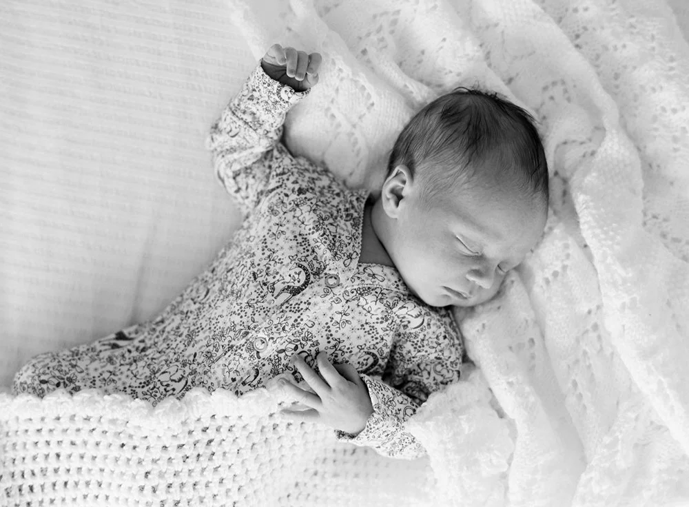 Portrait of a newborn baby girl asleep at home
