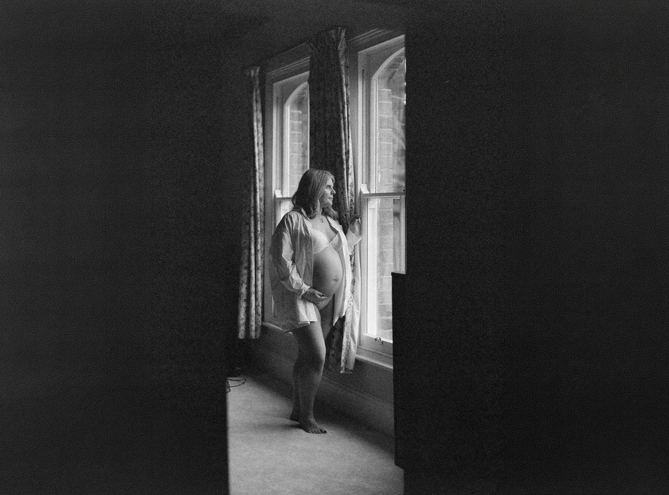 Portrait of a mum to be captured on black and white film