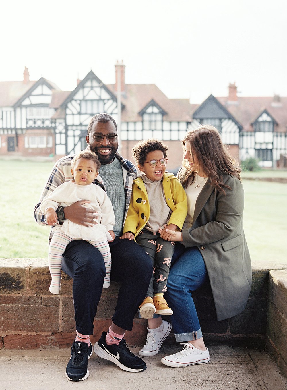 Portrait of a family of four captured on film in the picturesque village of Thornton Hough Wirral