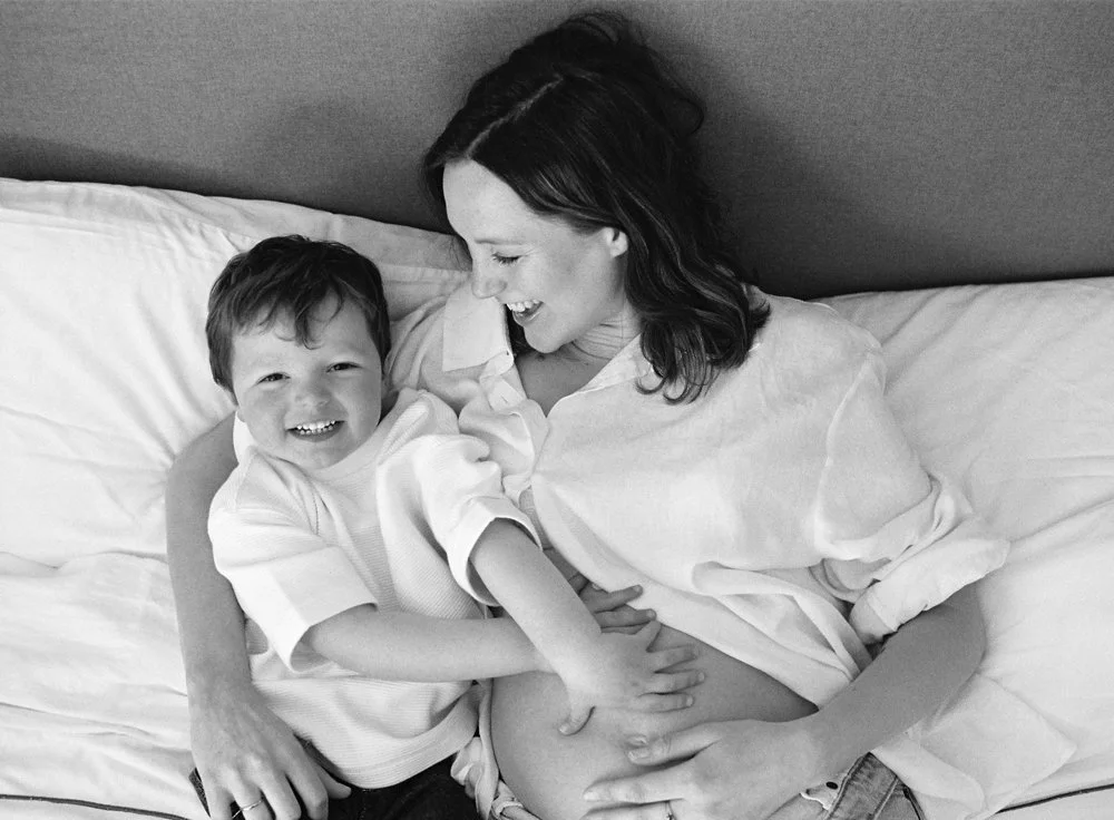 Portrait of a pregnant mother with her toddler at home