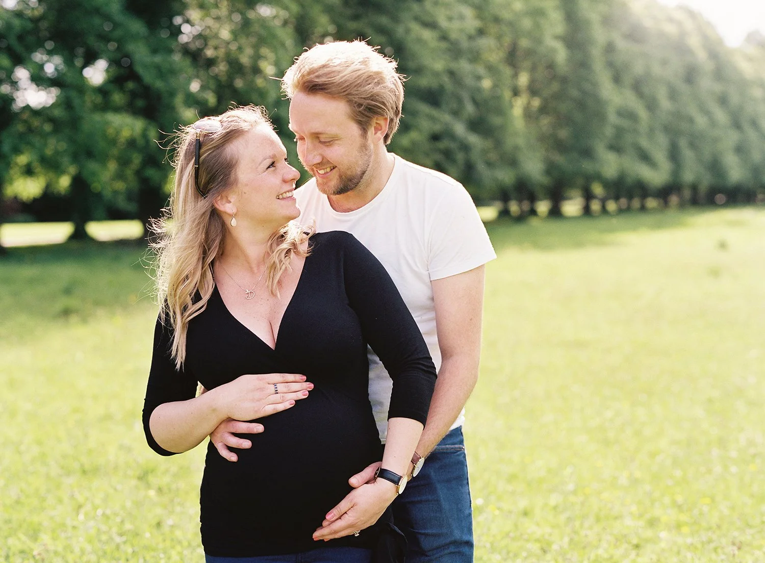 Outdoor maternity photograph of a young couple expecting their first baby captured by lifestyle photographer Victoria Phipps