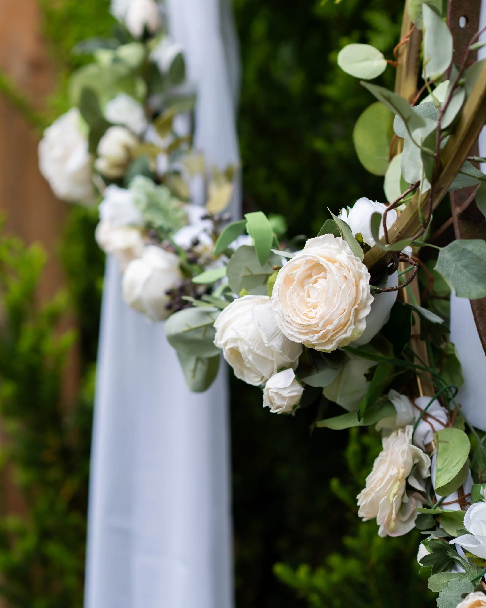 Exchange vows under an enchanted arch. Imagine walking down a flagstone aisle to a rustic wood-beamed archway draped in ivy and hanging lanterns, with seasonal flowers in full bloom all around. 

Our ceremony area brings fairytale romance to life &nd