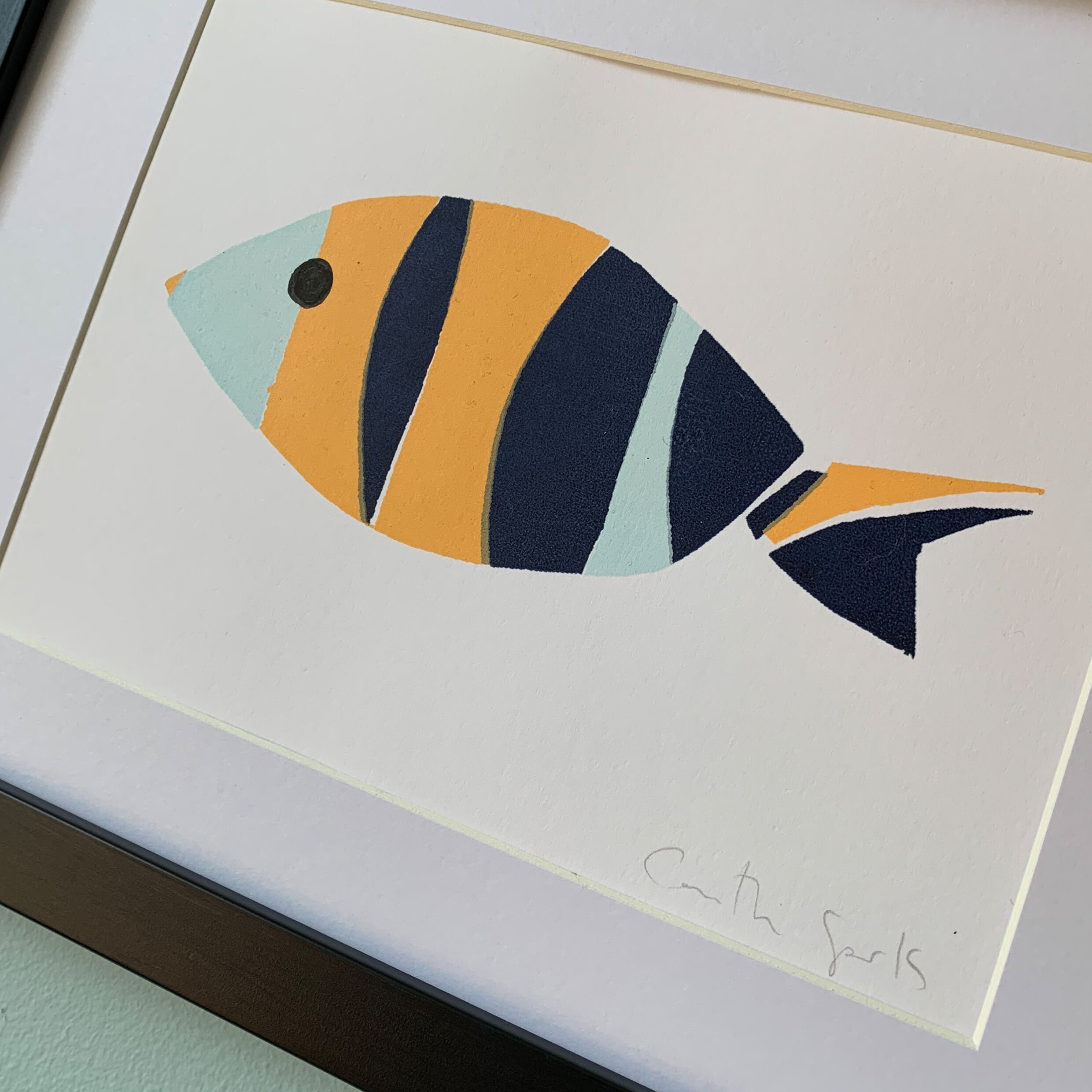 Close up framed original screen print of colourful patterned fish