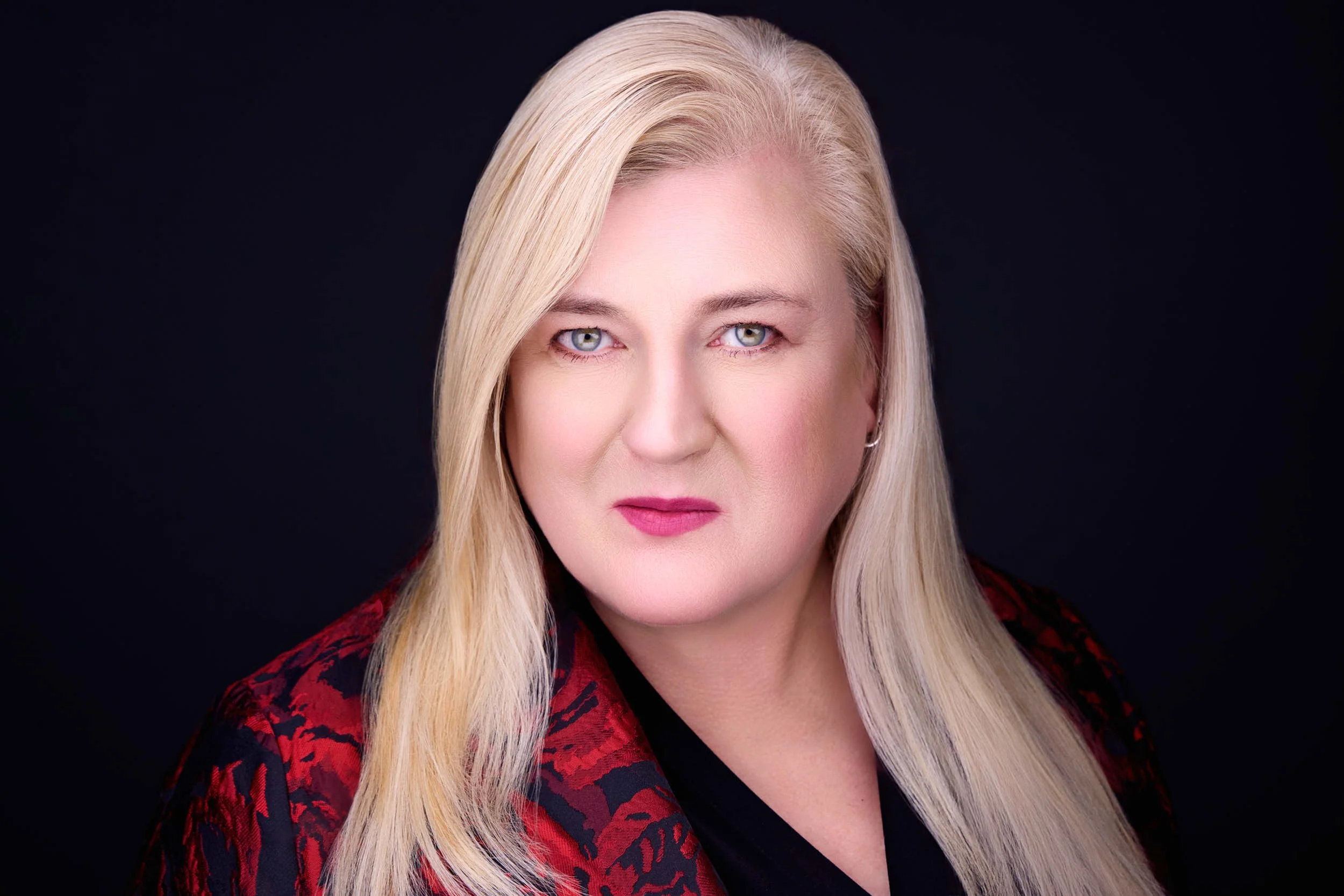 Professional headshot of a client in Rolling Meadows with a confident and approachable expression used in testimonial.