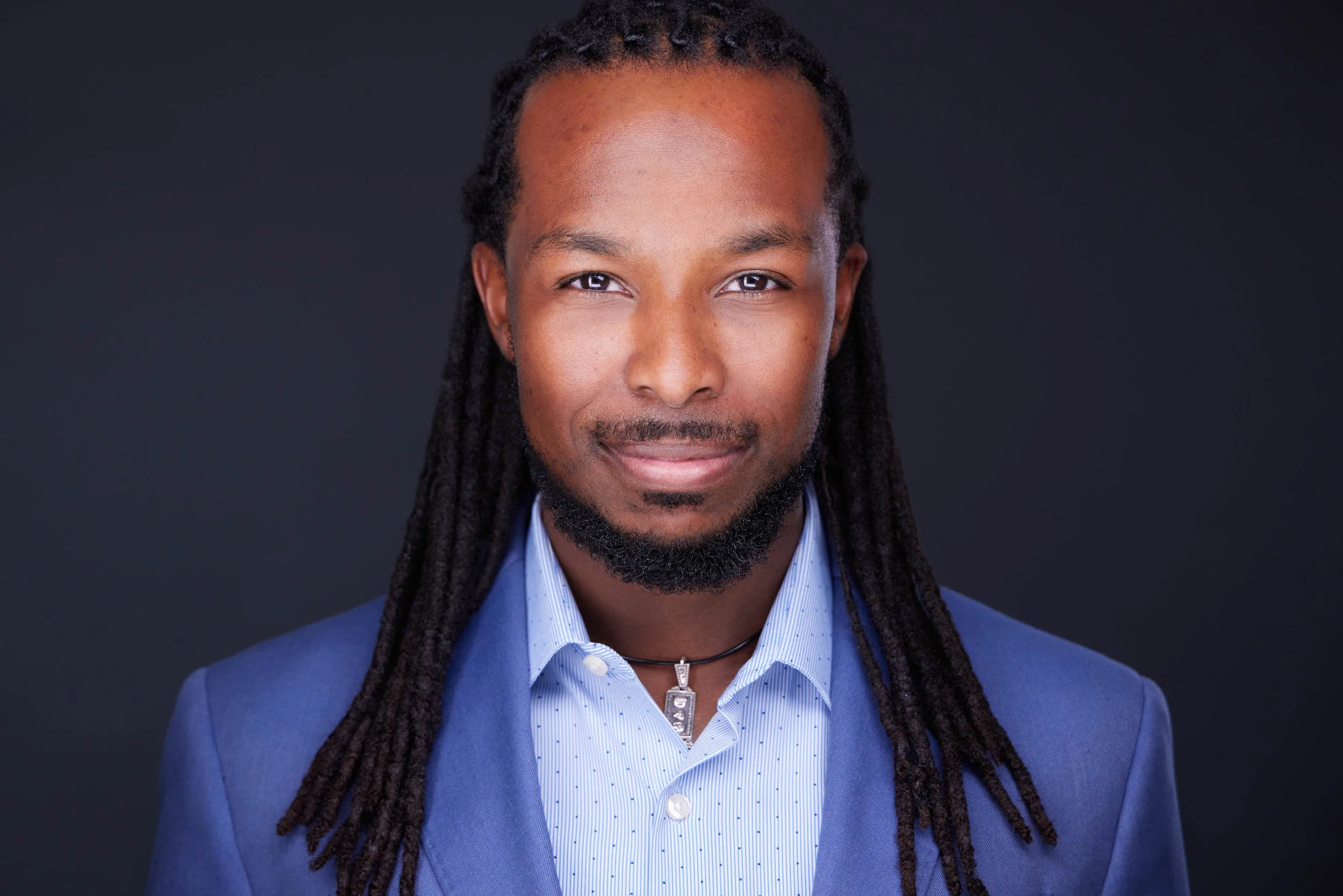 Final professional headshot showing confident presence and authentic expression.