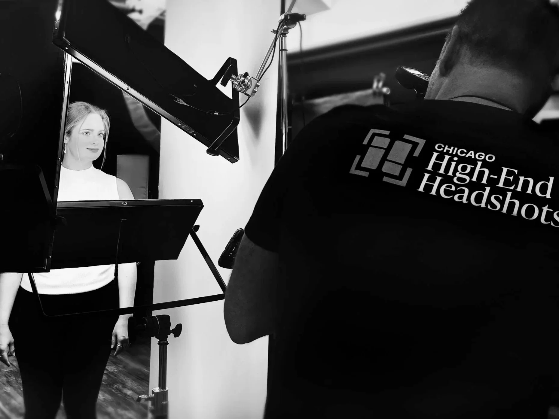 Behind the scenes headshot client being coached for confidence, approachability and presence during an in-studio session.