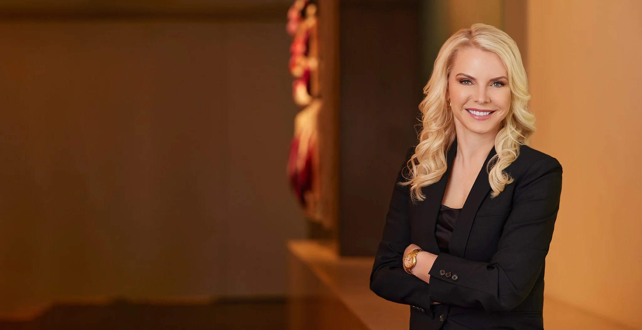 Environmental personal brand portrait of a professional in a modern interior.