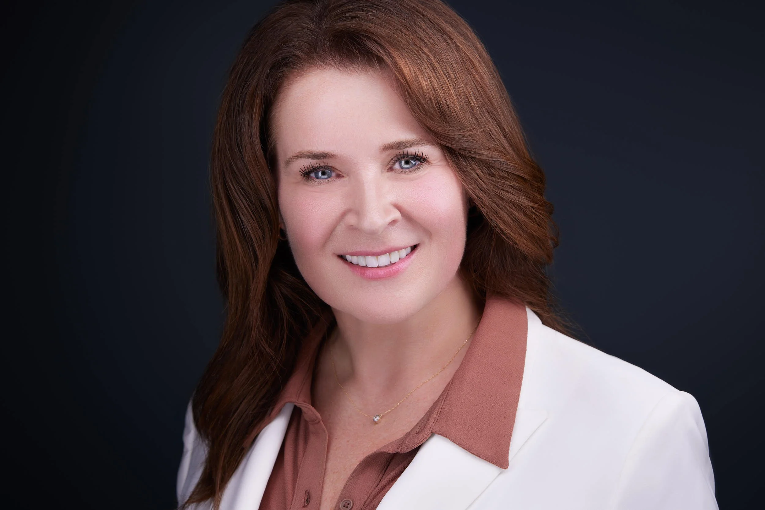 Businesswoman’s corporate headshot showcasing confidence and approachability for professional branding in Rolling Meadows and Chicago Northwest Suburbs..