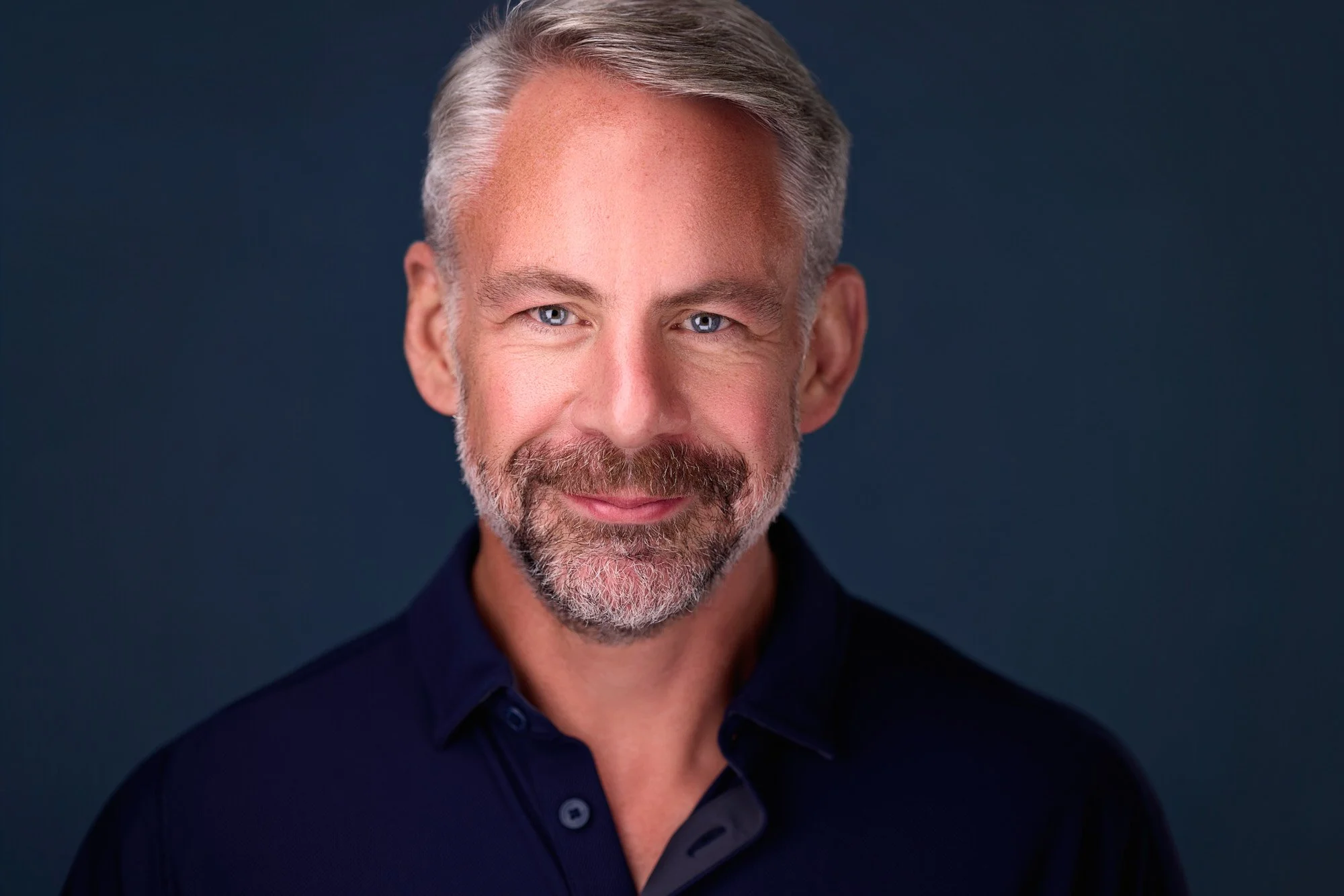 Professional displaying confident and approachable eye expression during a headshot session.