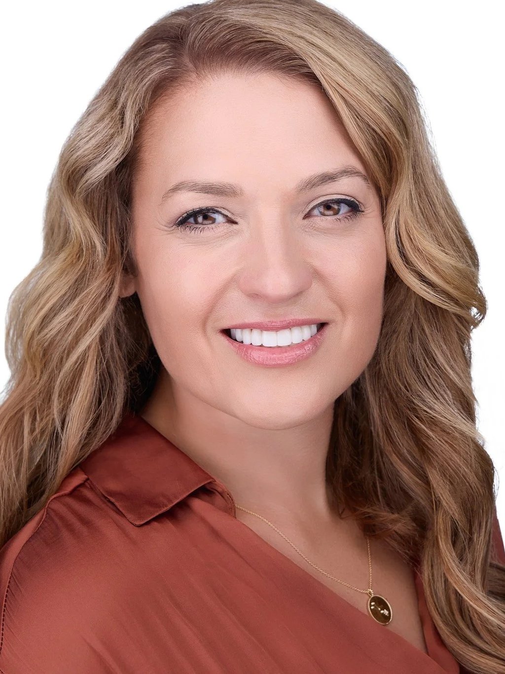 Personal brand portrait with a warm, approachable expression.
