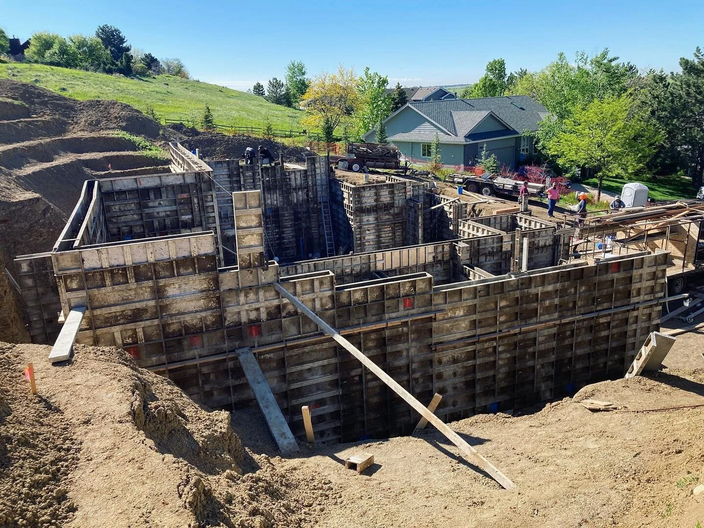 Caissons are in and the forms are almost ready for concrete at this hillside single family home project in Fort Collins. 

The site allowed us to create a walkout patio on the main level and second floor along with lots of natural light in the baseme
