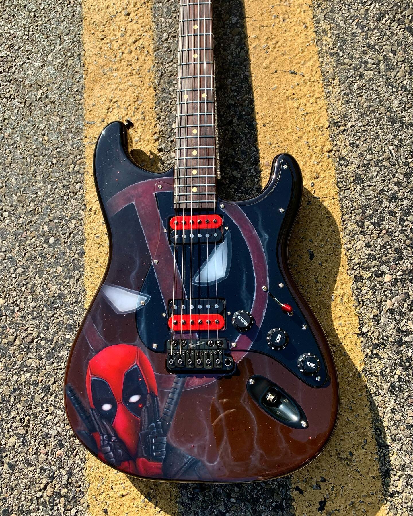 Deadpool theme guitar for @jl_custom_guitars . This beautiful piece is fully custom built and is for sale so give him a DM if you&rsquo;re interested in the one of a kind piece of art.  #customairbrushart #artwork #airbrush #iwata #ppg #kokendakustom