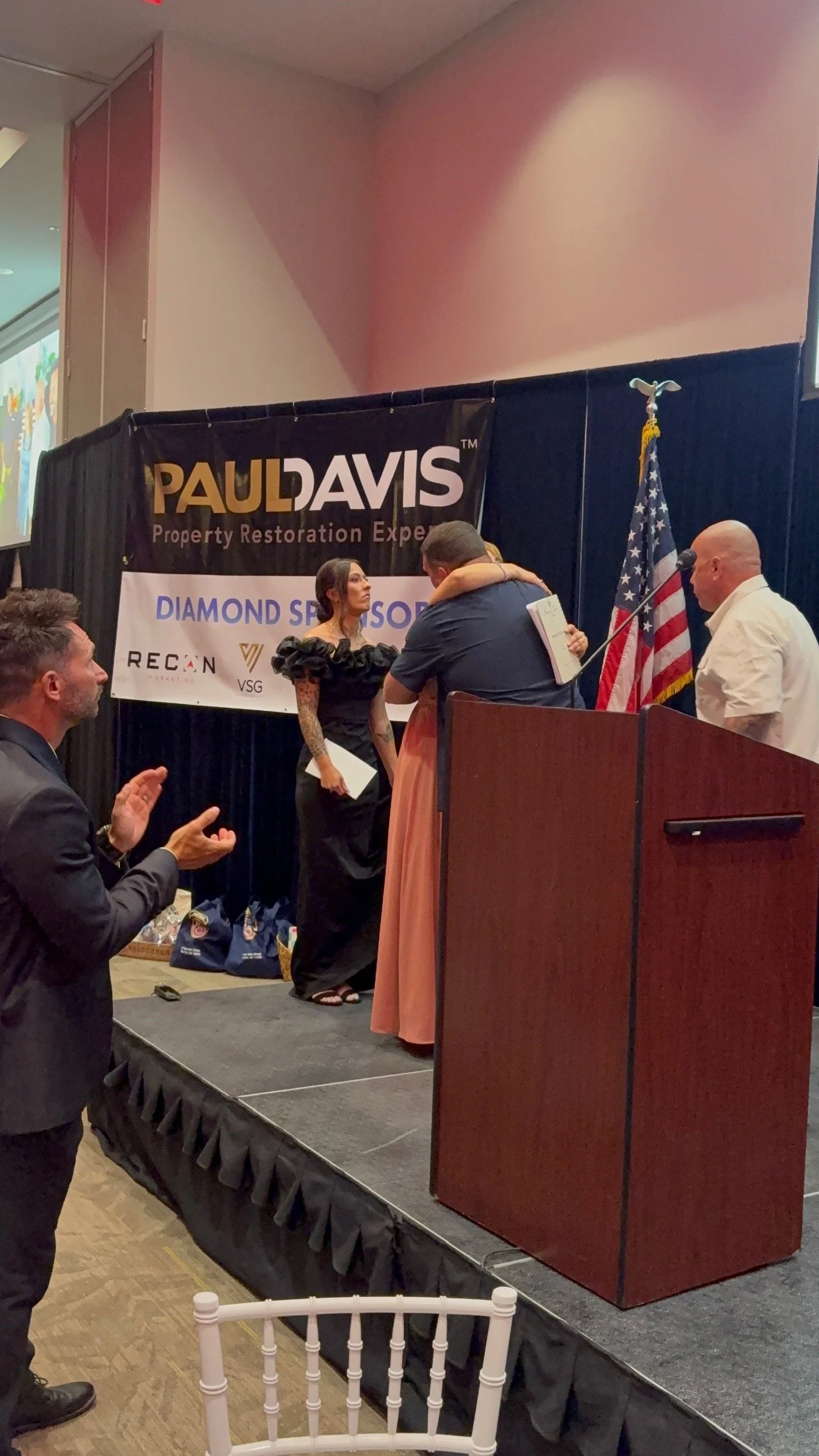 Helen Comperatore hugging Scott after introducing her