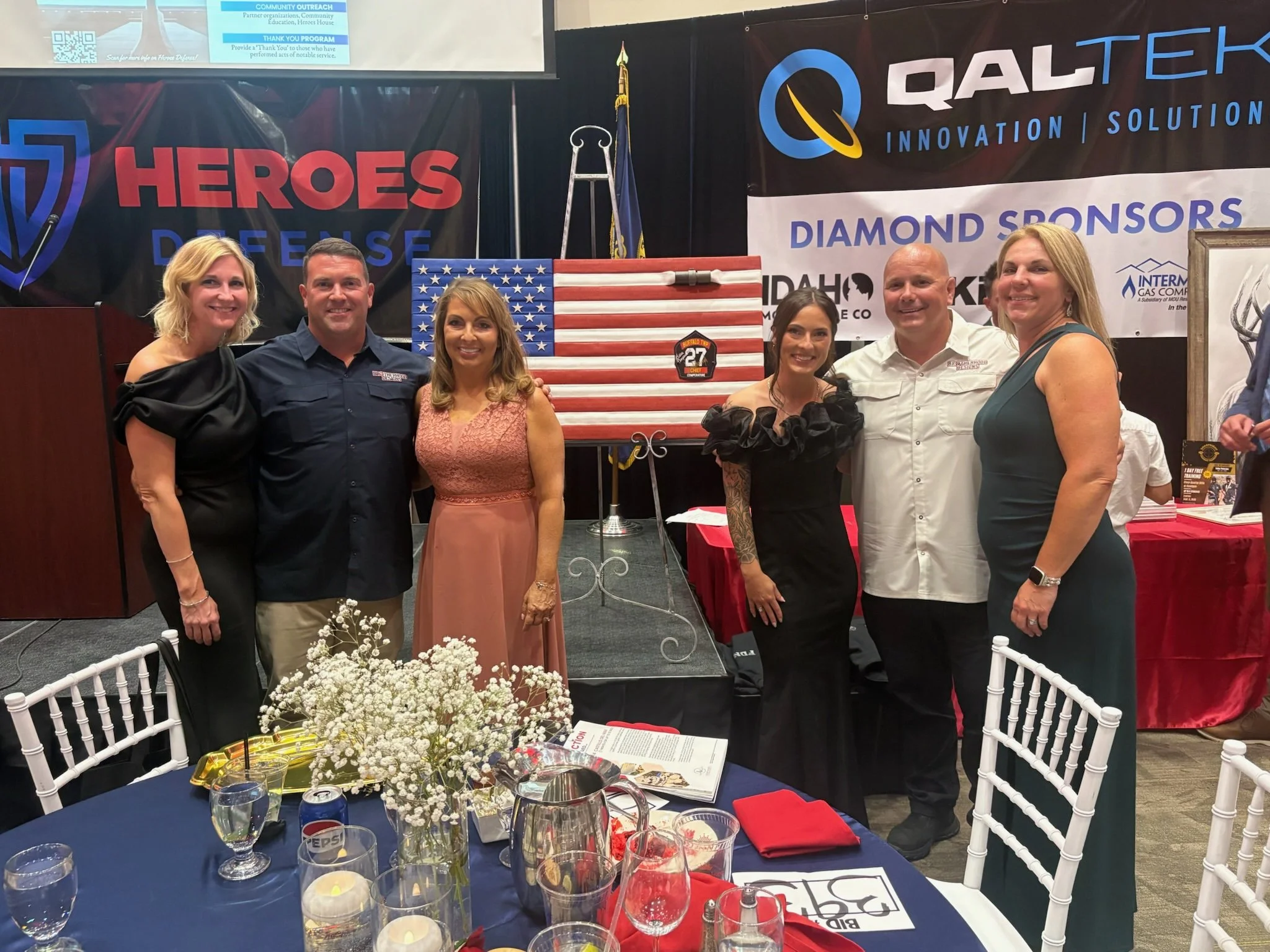 Scott, Mallory, Rob, Christi, Helen and Kaylee Comperatore at the Heroes Defense 11th Annual 9/11 Tribute Gala, in front of Comperatore Series Flag #4