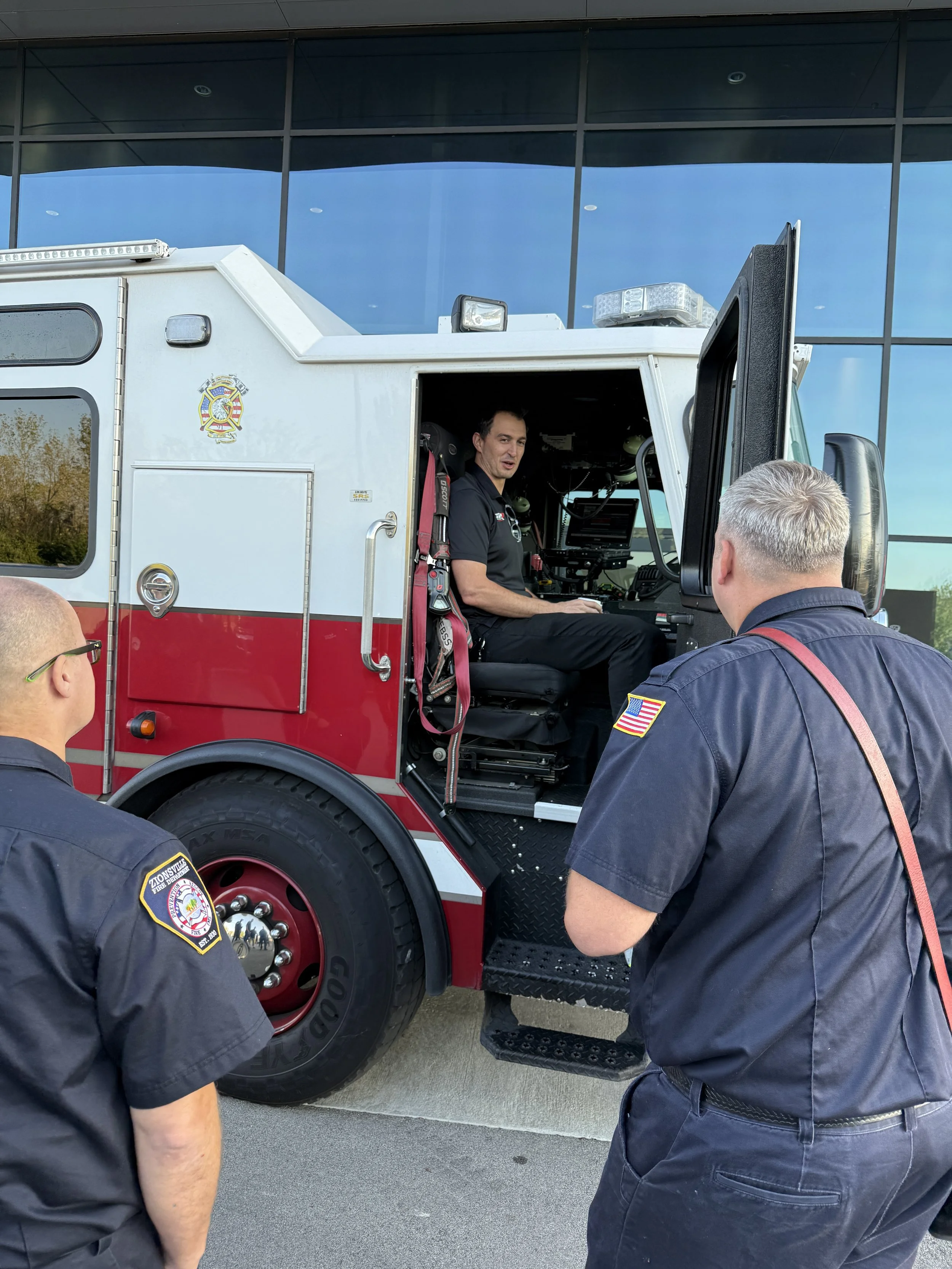 Graham Rahal sitting in officer seat in Zionsville fire engine E291
