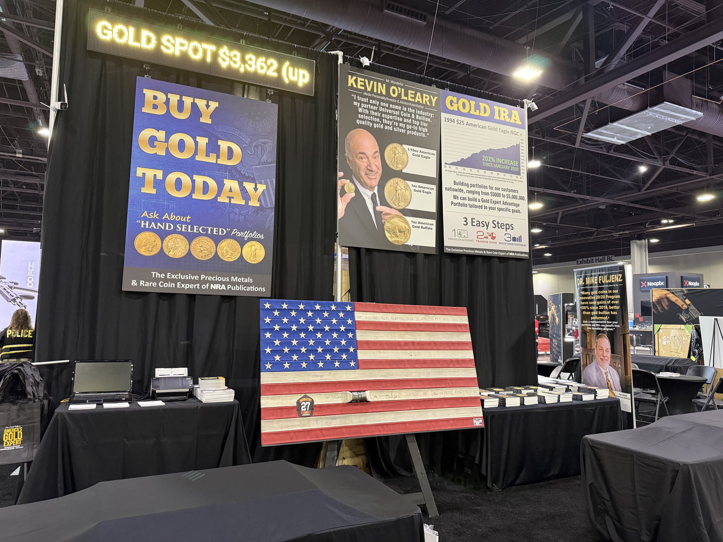 Comperatore Memorial Flag #106 on display at the NRA Annual Members Meetings and Exhibits - Universal Coin and Bullion Booth