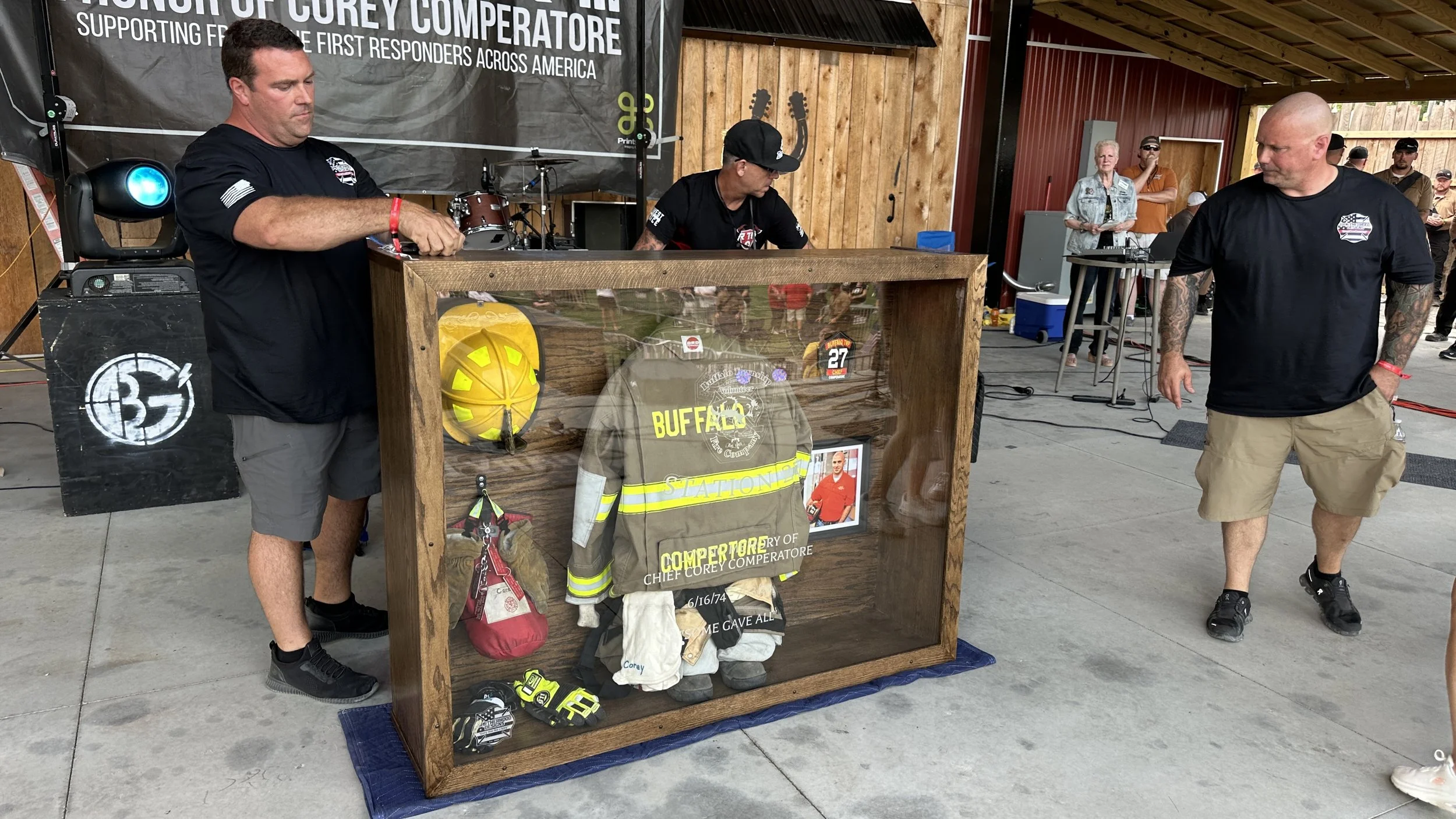 Custom fire gear display case from BDC - unveiled at the memorial on 7/12/25 - presented to Helen, Kaylee, Allyson Comperatore and Buffalo Twp Volunteer Fire Company