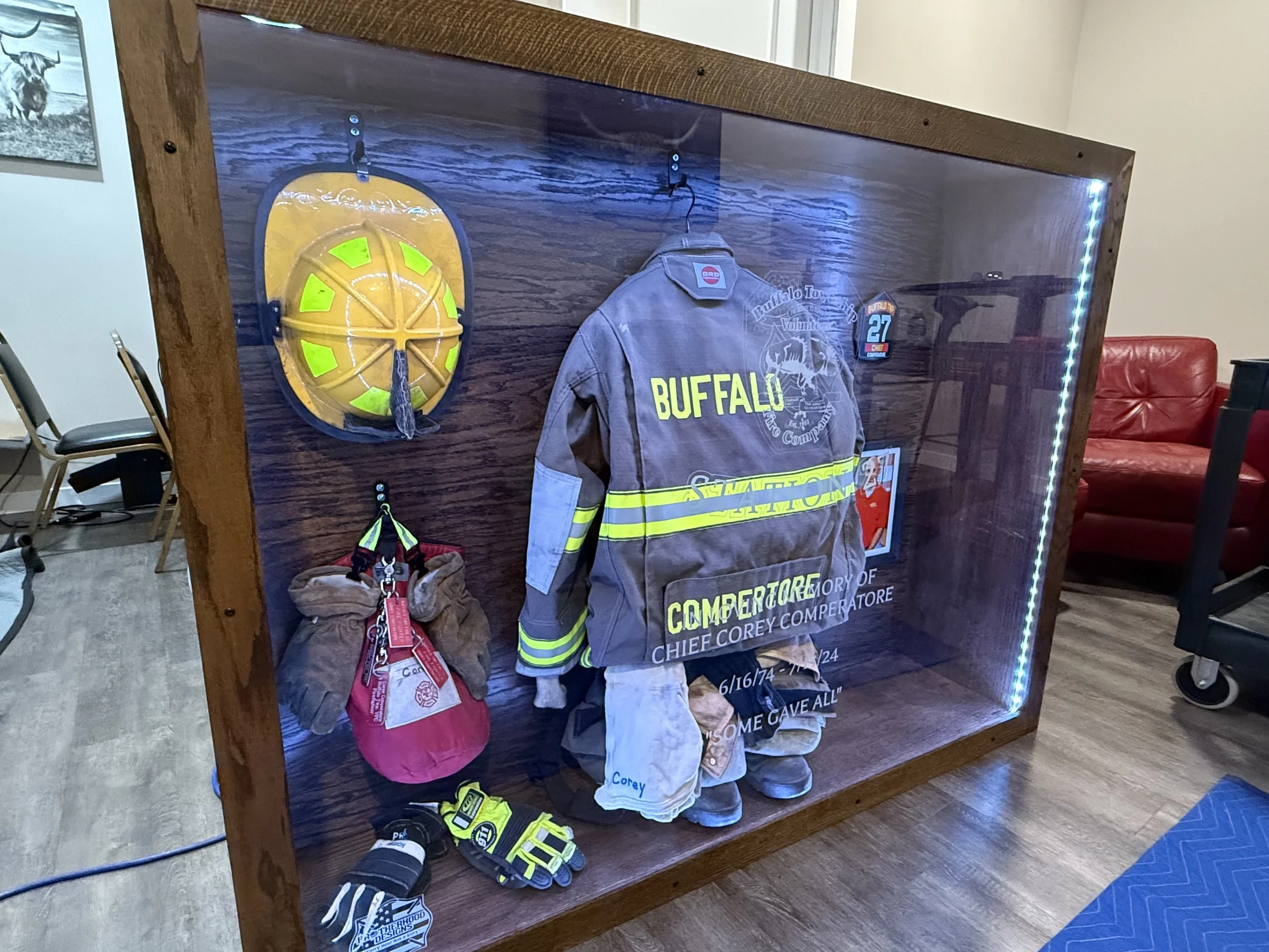 Custom fire gear display case from BDC - unveiled at the memorial on 7/12/25 - presented to Helen, Kaylee, Allyson Comperatore and Buffalo Twp Volunteer Fire Company