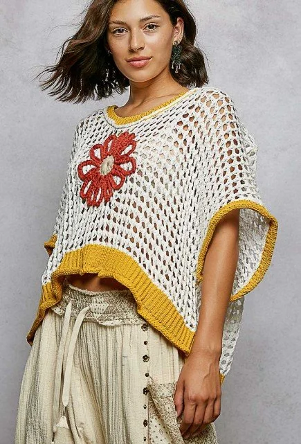 POL Brand
Lightweight knit. The design is accented with a handmade floral detail and finished with a subtle rolling edge,  
SIZES: S, MD, LG  #906-22FS
$48  COLORS: White with mustard trim and burnt orange flower