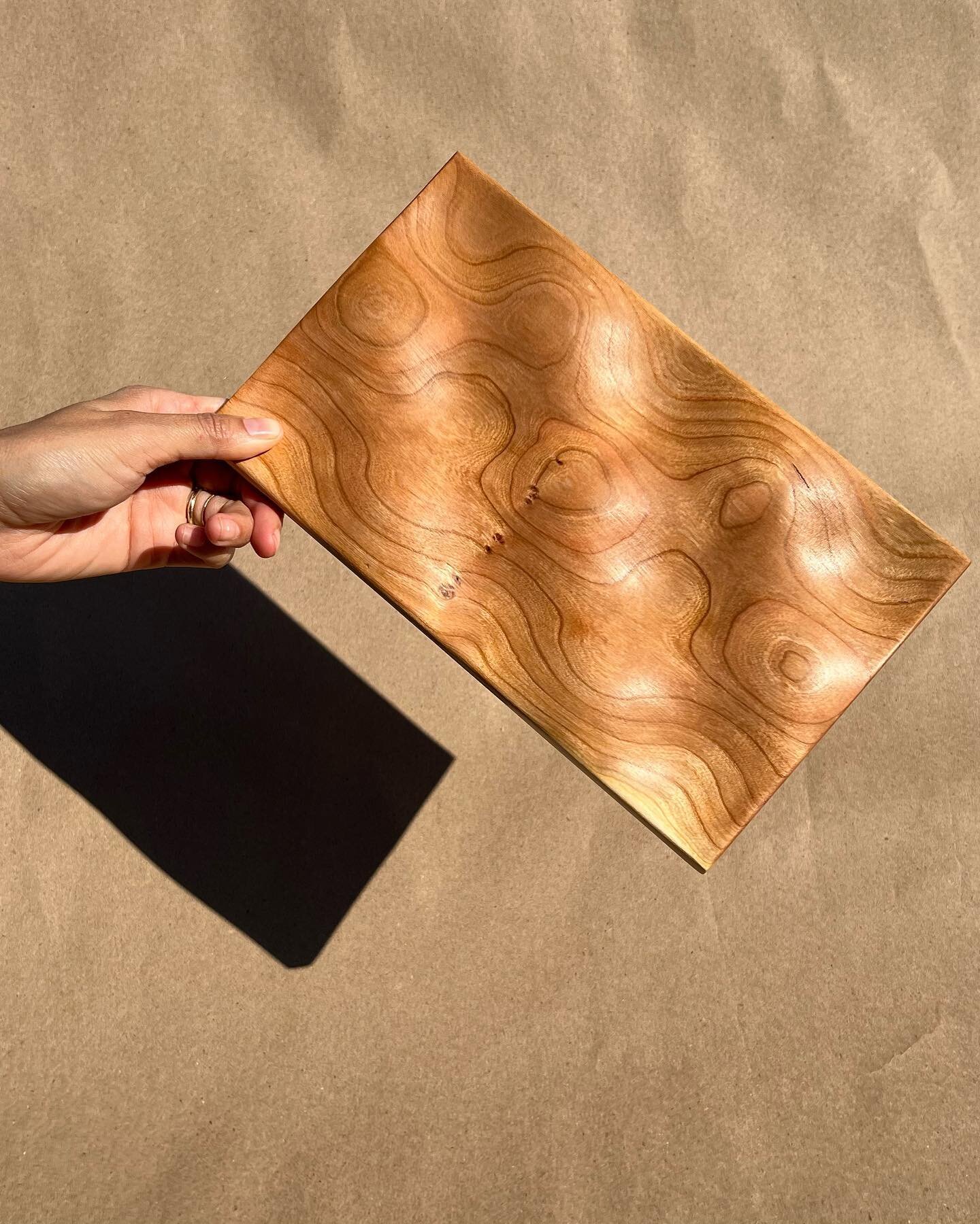 Let&rsquo;s have a moment of appreciation for the grain on this Cherry Topo Tray!

Dark rings of grain give our cherry wood products a striking finish, and never is that contrast more apparent than in our Topo Trays. Just as no two trees are the same