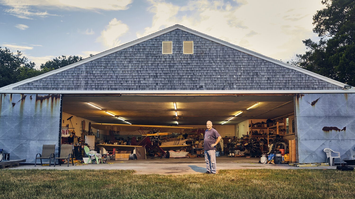 Owner of Cape Cod Airfield, Chris Siderwicz Sr. stands in front of his hangar. 
Cape Cod Airfield, Massachusetts 