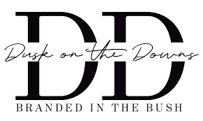Logo with large stylized 'D' and 'D', and text 'Dusk on the Downs' and 'Branded in the Bush'