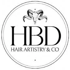 Logo for HBD Hair Artistry & Co featuring a ram's skull above the company name.