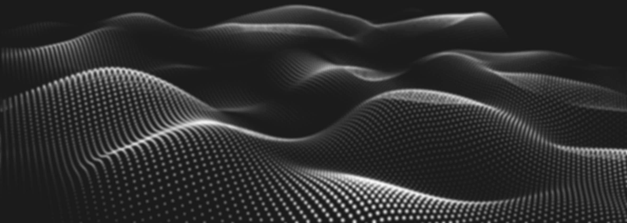 Surface ondulée formée de petites lumières blanches sur un fond noir.