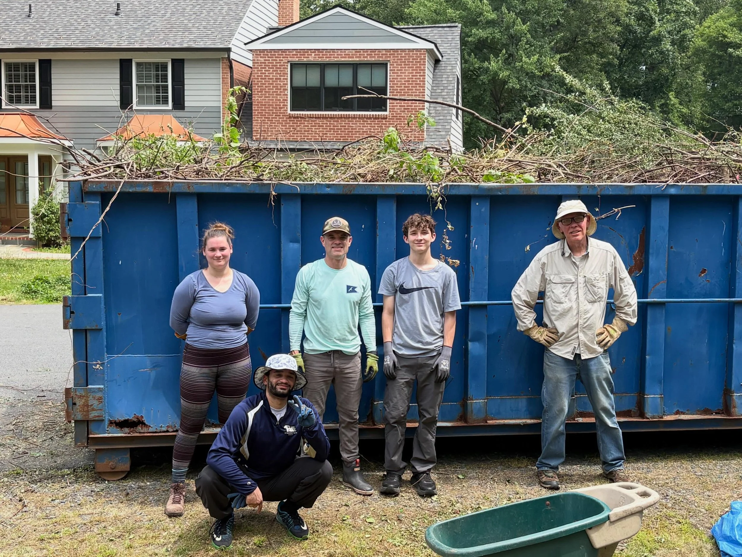It was a gruelingly hot day in Greenway Heights, but our 8 intrepid volunteers were ROCK STARS!  We had a HUGE task of filling a dumpster with the remains from our work the past few weeks, and they rose to the occasion to fill that dumpster to the br
