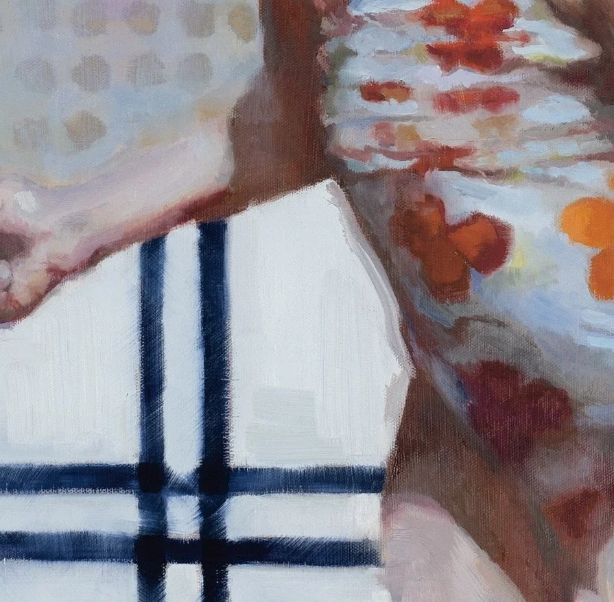 Close-up of a painting showing a hand and part of a face with floral patterns, next to a black and white checkered pattern.