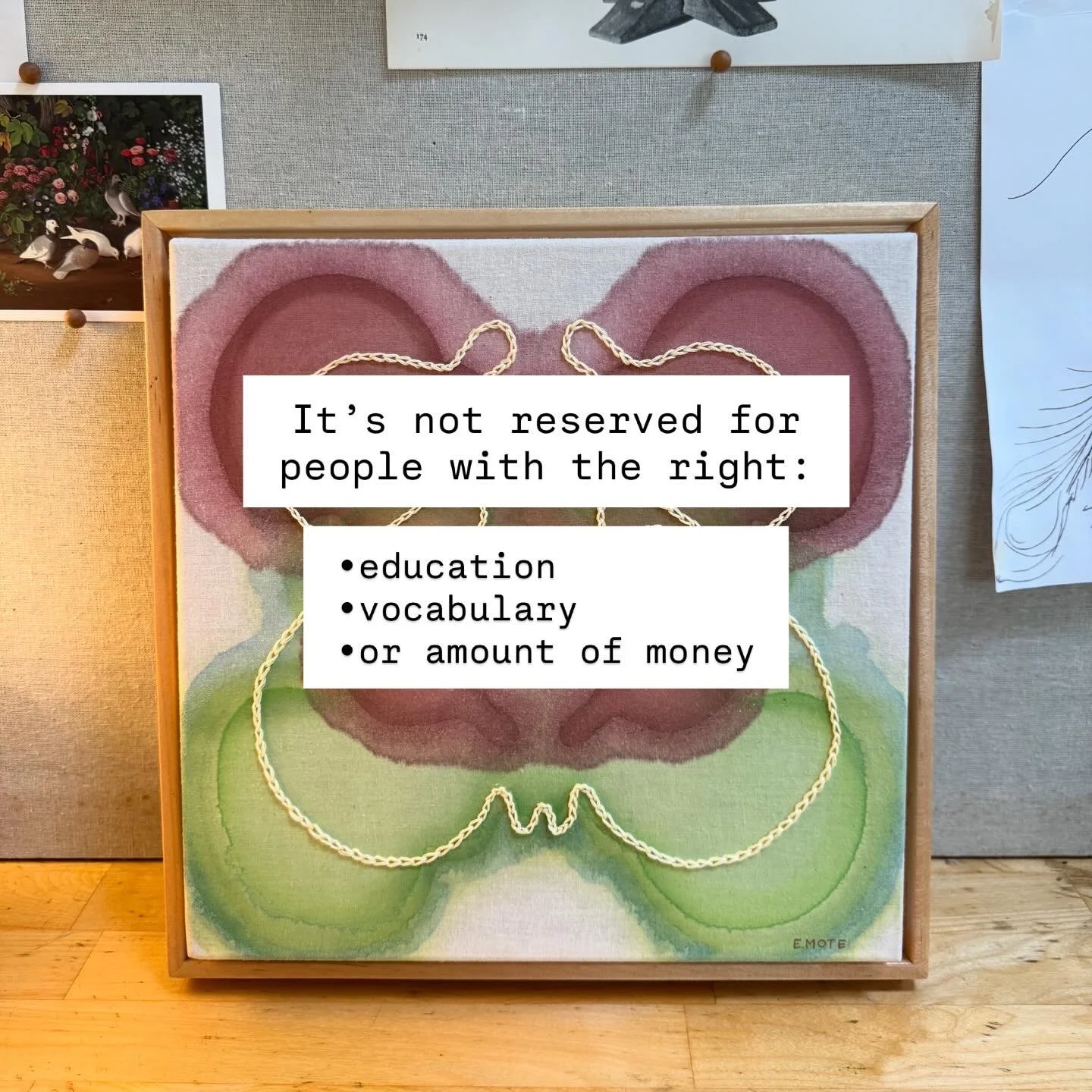 A framed artwork with a watercolor butterfly design featuring pink, green, and purple hues, with a quote overlayed that reads: "It's not reserved for people with the right: education, vocabulary, or amount of money."