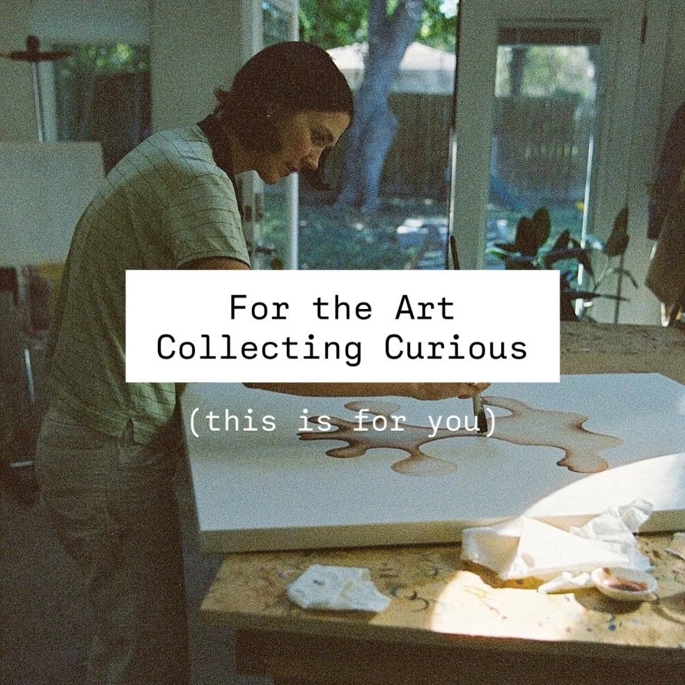 A woman in a striped shirt is working on an art project, creating a layered, abstract design on a large foam board in a well-lit room with large windows showing a backyard with a tree and deck.