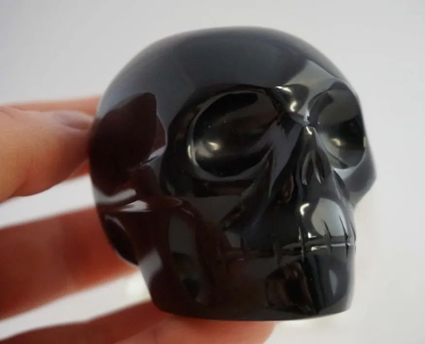 Obsidian: Grounding Your Grief

Obsidian is made of hardened volcanic lava, referred to as volcanic glass. Sharp and powerful, strong enough to withstand the scorching heat of the center of the earth - my absolute favorite stone for grounding the cha