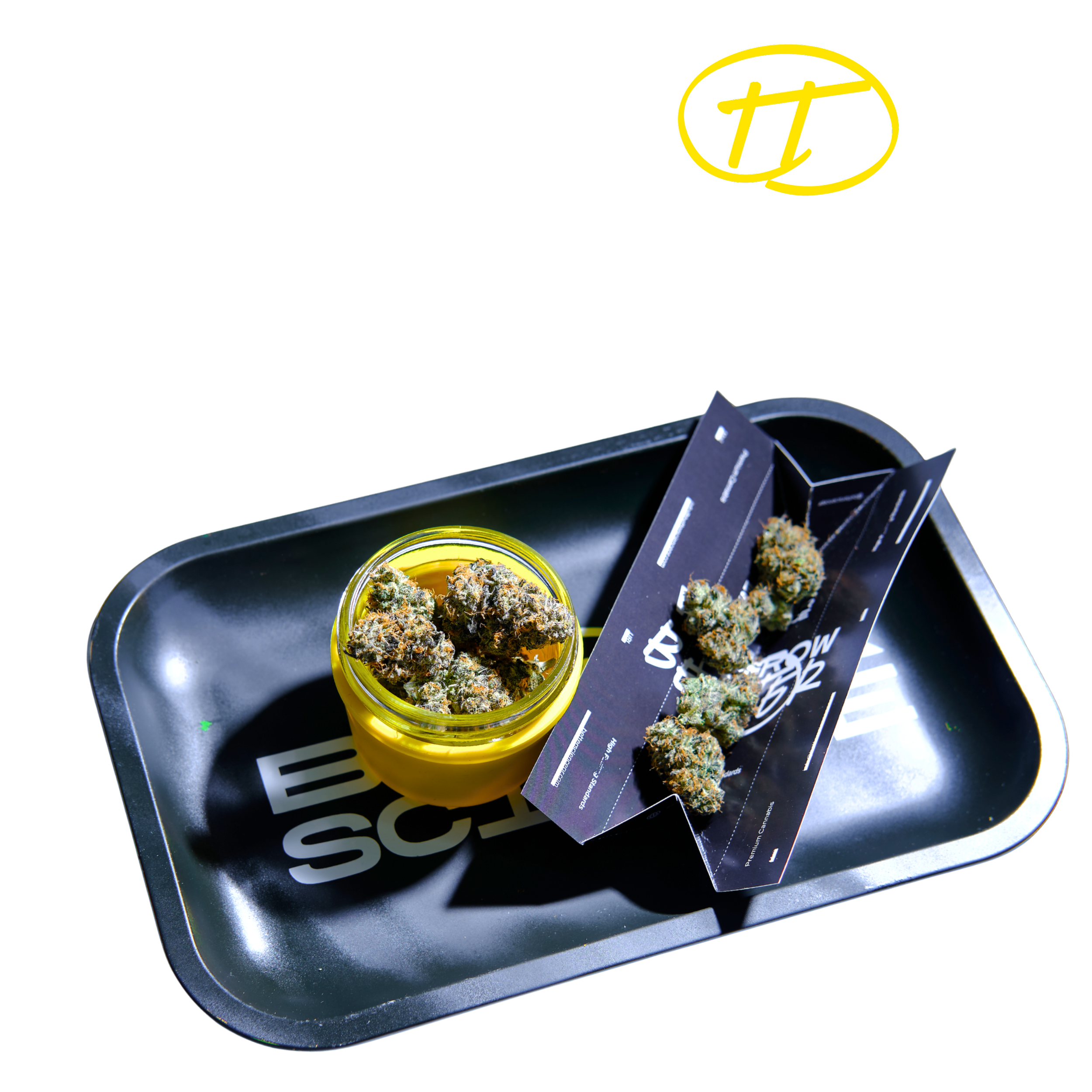 Black tray holding a small yellow container filled with cannabis buds and a promotional card with cannabis images.