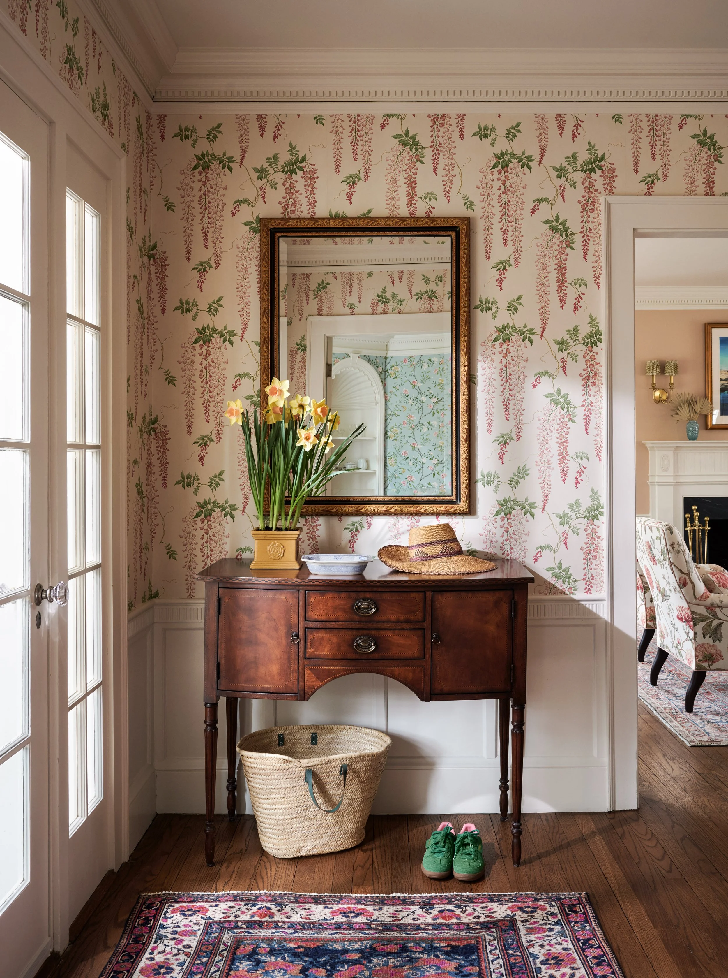 layered foyer with wisteria wallpaper and vintage accents