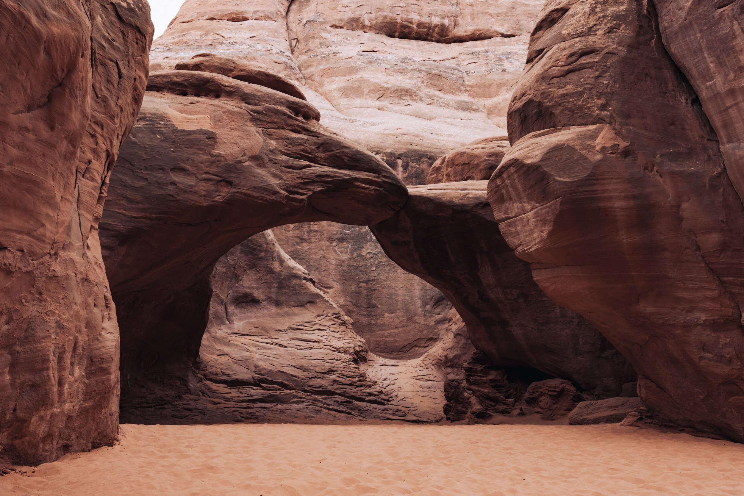 Natural sandstone arch in a desert landscape