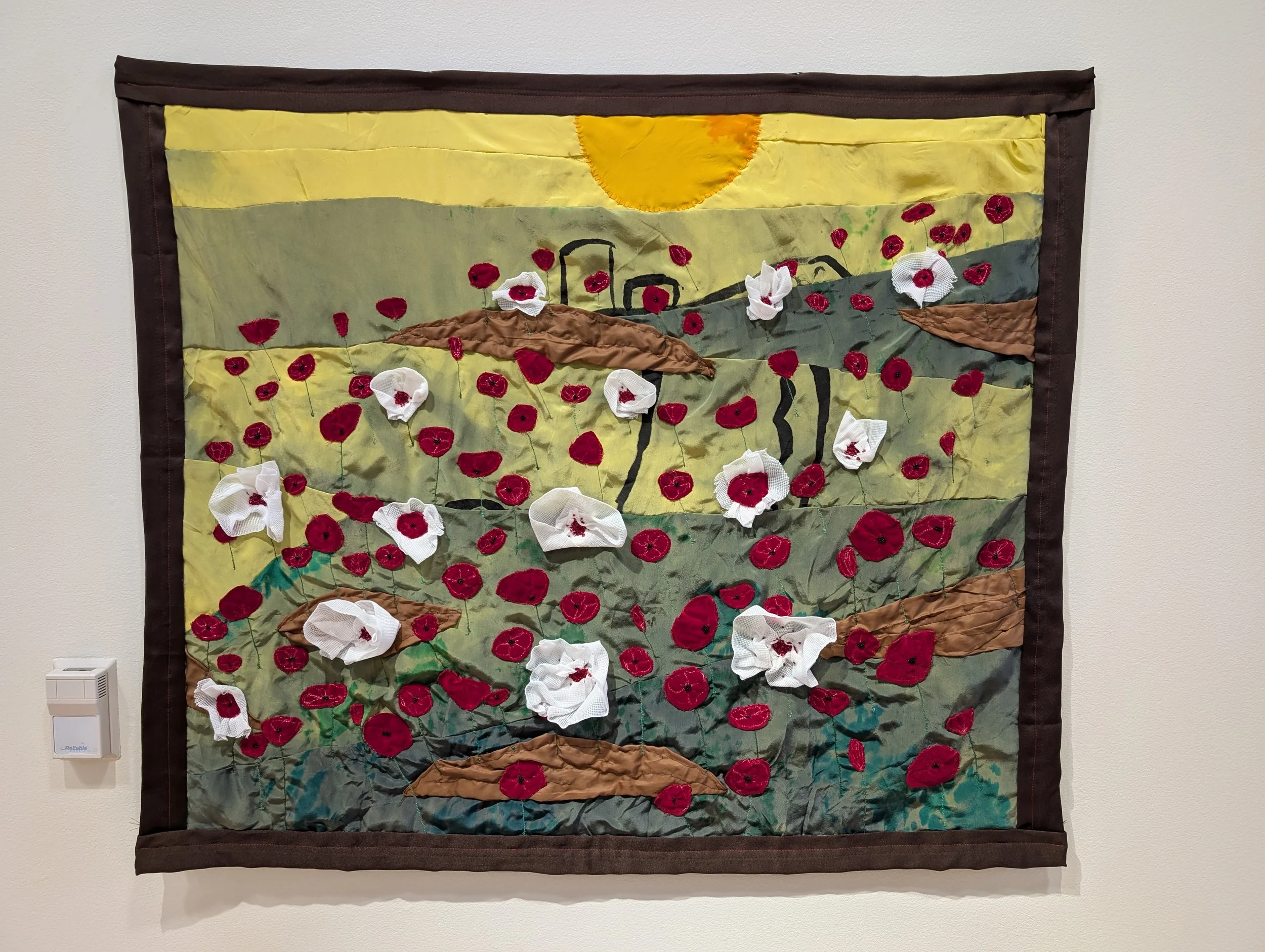 Lucas J Rougeux, The Land Grows through its Scars , 2024, mixed found fabric, gauze, glass beads, 35" x 40", $3000