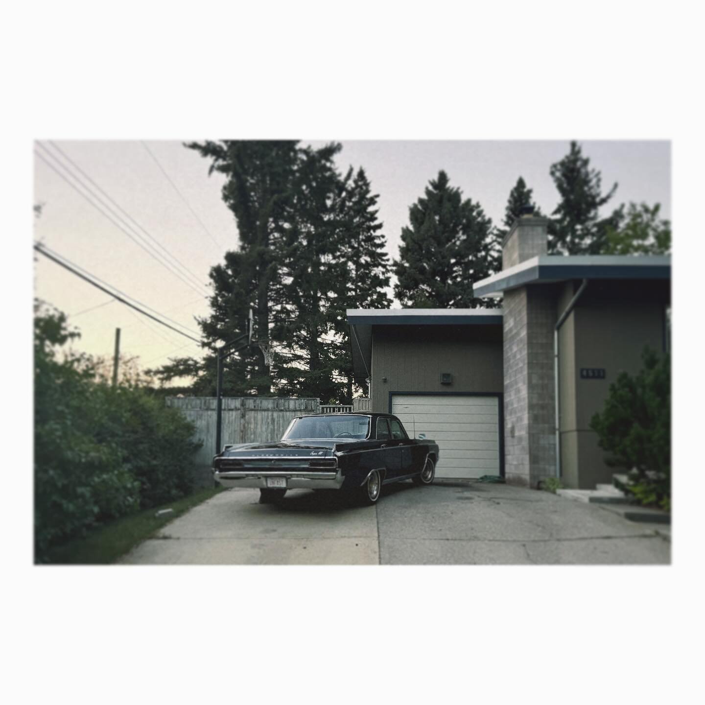 &ldquo;Unfast&rdquo; rider at rest. #neighborhood #vintagecar #yyc #diaporama
