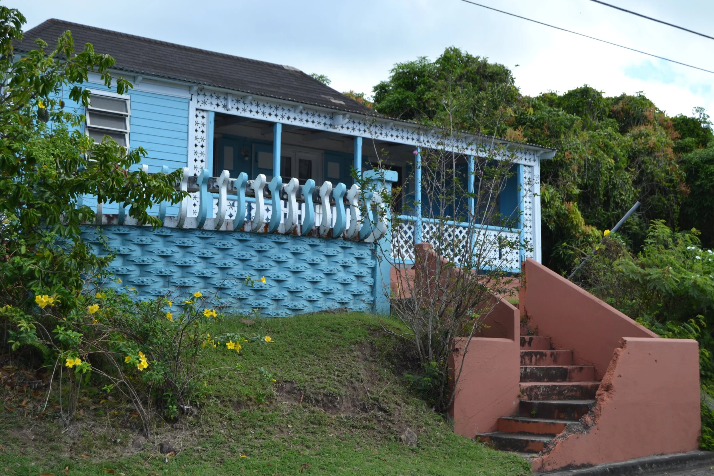  While many houses on Nevis are traditional Caribbean style wooden cottages, newer homes are often made of concrete to better weather storms. However the colorful touch remains. 