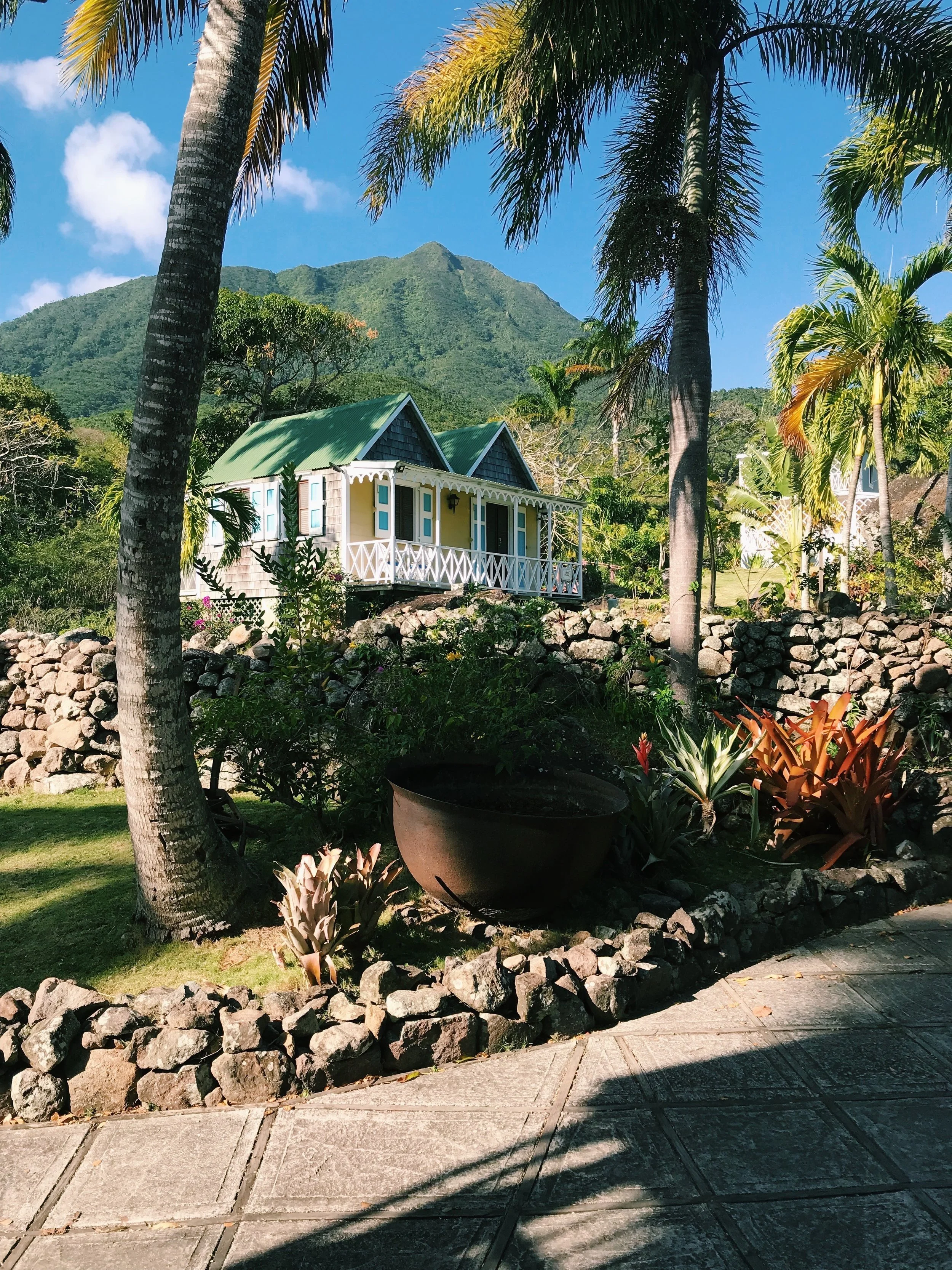  One of the balcony rooms at The Hermitage, where guests staying at the inn can have a taste of a traditional Caribbean wooden cottage. 