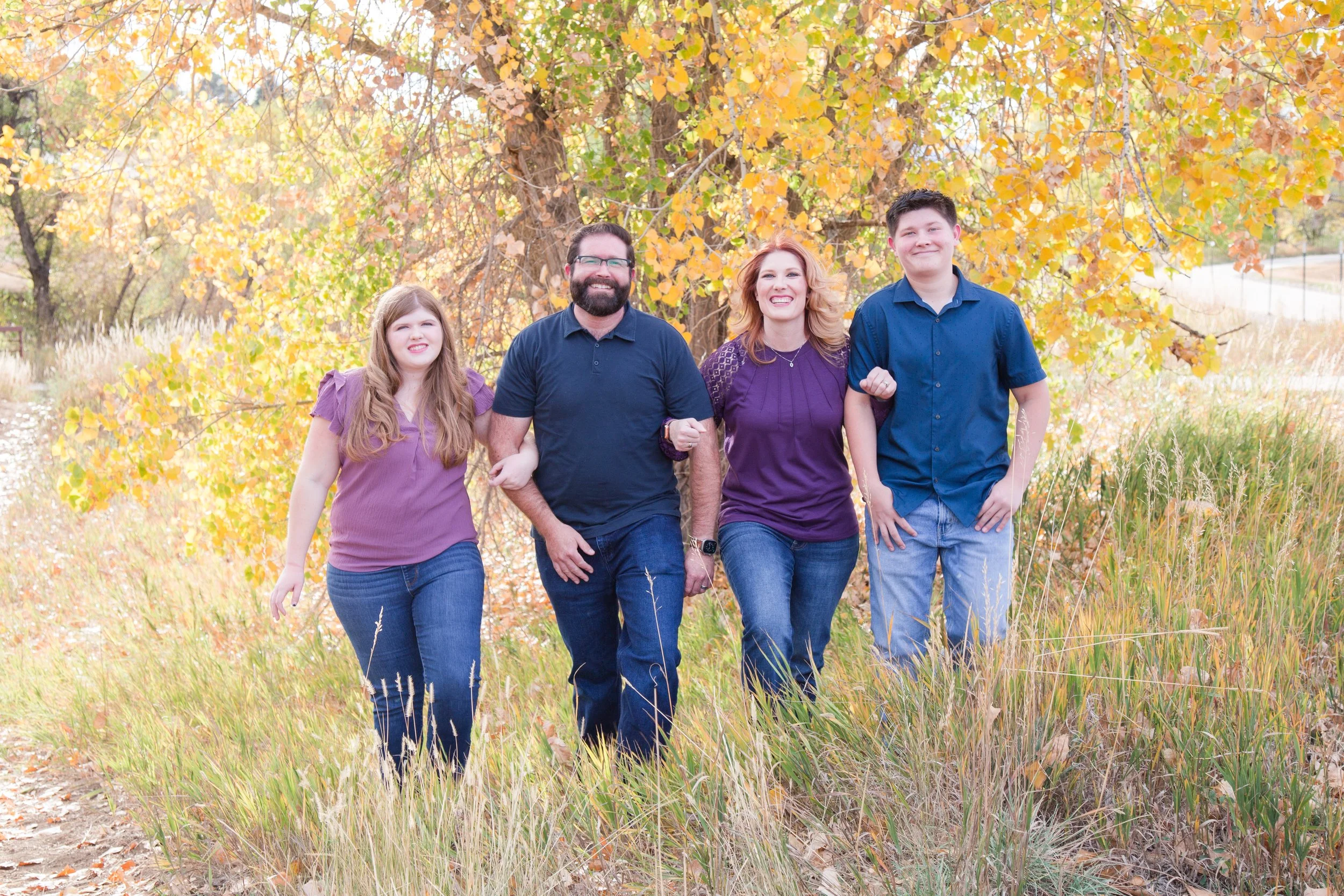 Family photo session under golden trees in Denver, Colorado