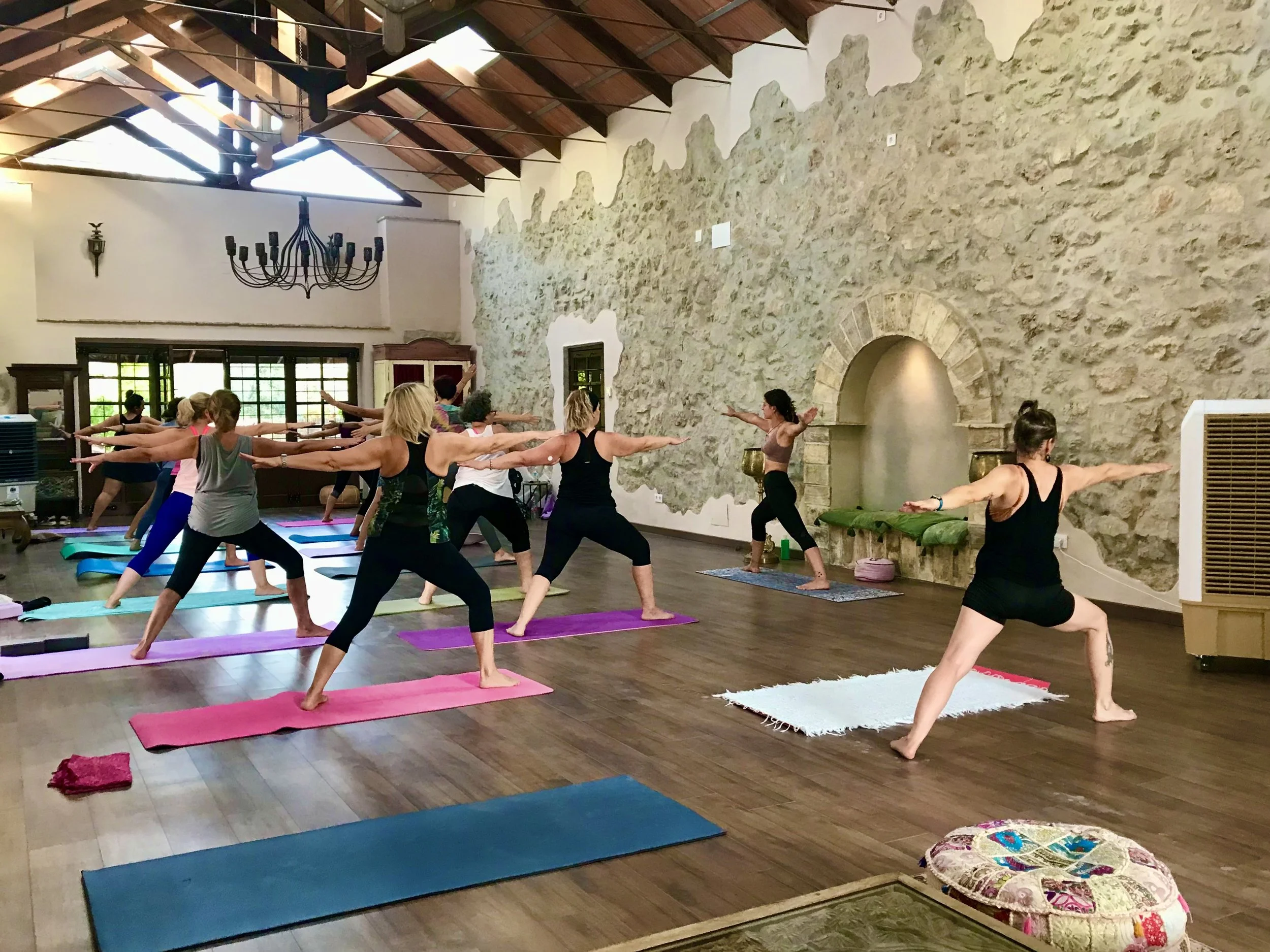 A group of women participating in a yoga class retreat with Yogabreathworks London