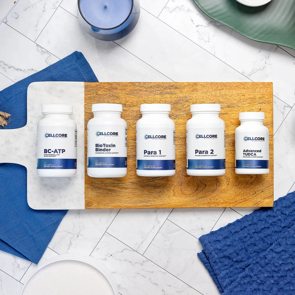 A selection of CellCore Biosciences supplement bottles on a wooden board