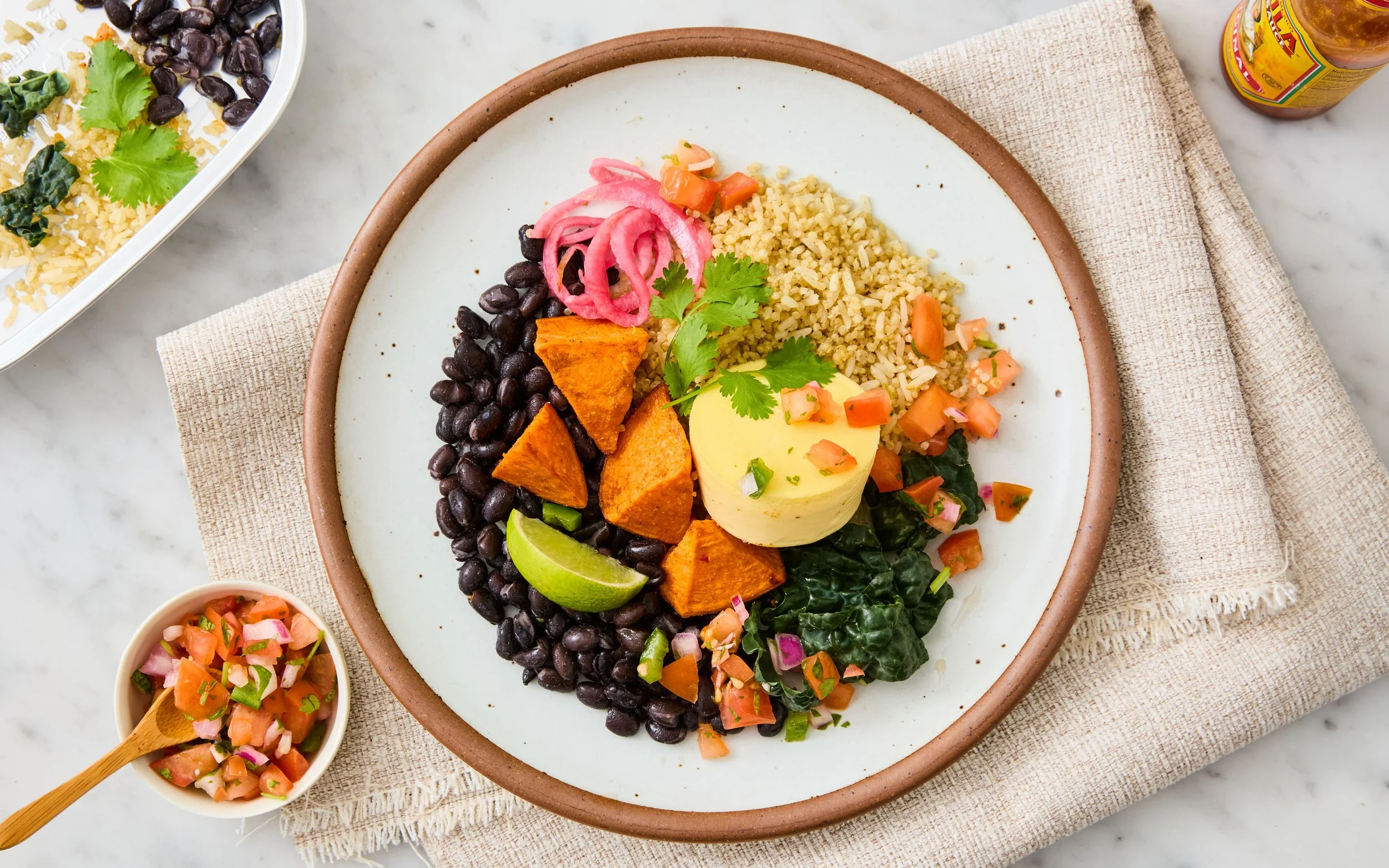 Southwestern breakfast egg bowl with soft-boiled egg, black beans, and roasted sweet potatoes