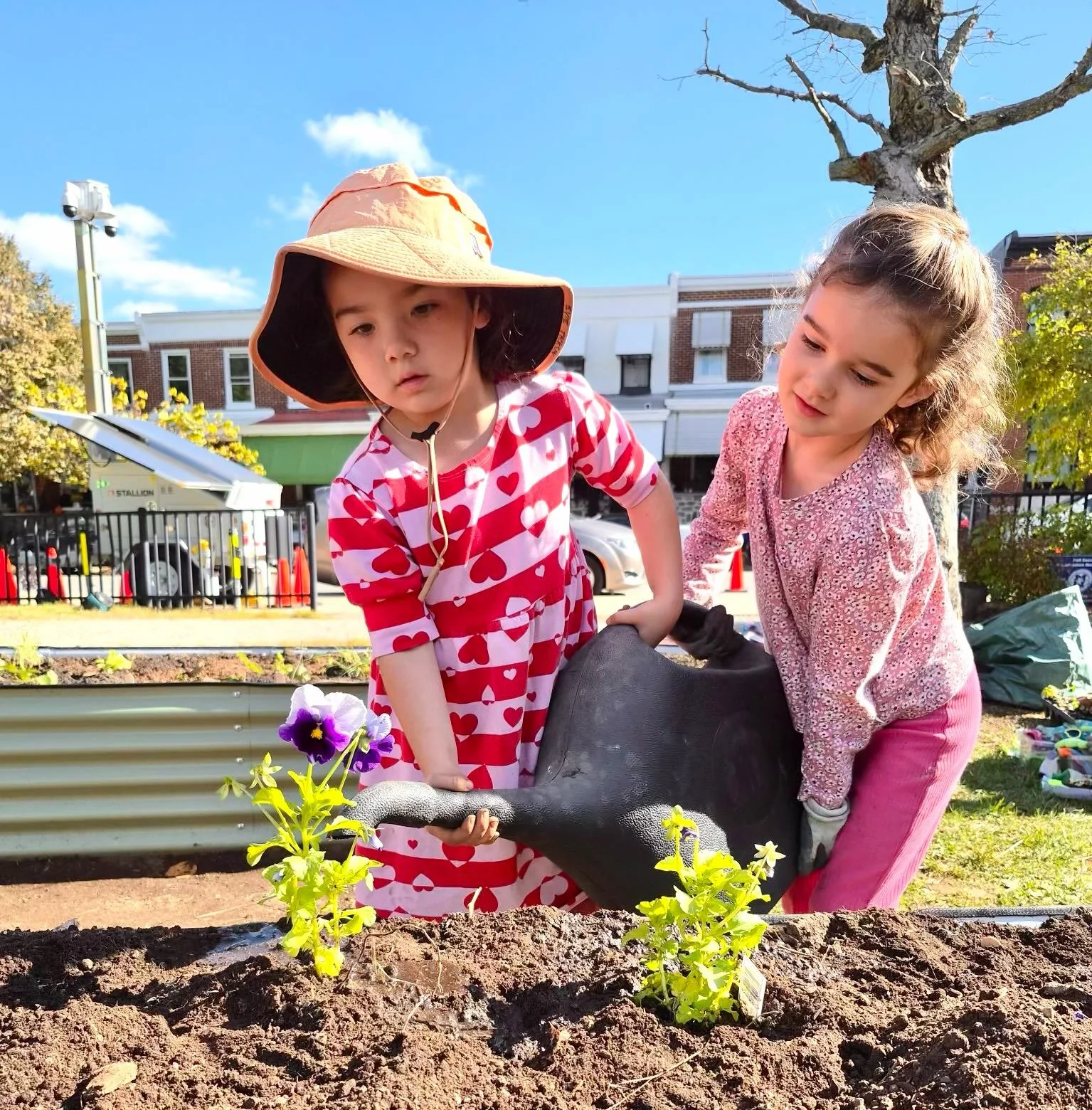 Our sweet gardeners! The new garden beds have been filled with a range of future tasty treats. Thanks to all for coming out!! Looks great!